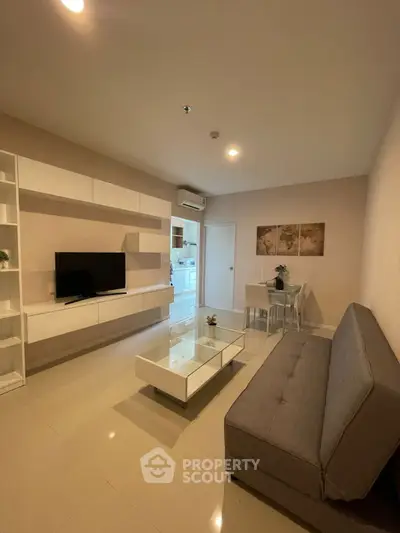 Modern living room with sleek furniture and open layout, perfect for contemporary living.