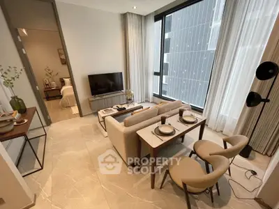 Modern living room with elegant decor and large windows in a luxury apartment