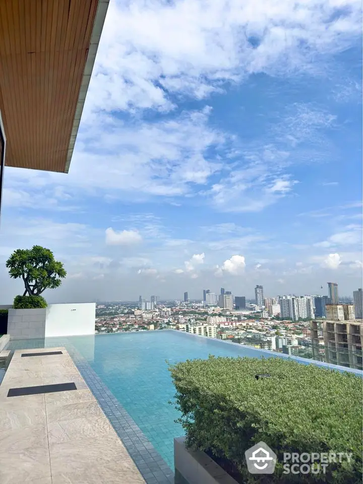 Stunning rooftop infinity pool with panoramic city skyline view