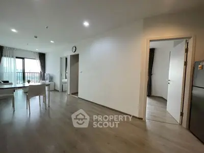 Spacious modern living room with open layout and balcony view