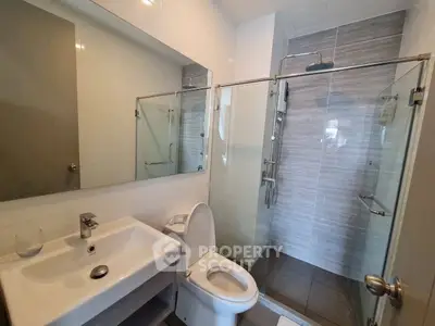 Modern bathroom with glass shower and sleek fixtures