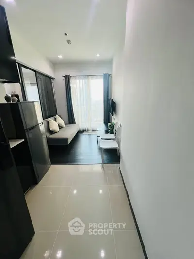 Modern apartment interior with sleek design and natural light, featuring a cozy living area and stylish decor.