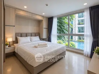 Luxurious bedroom with pool view in modern apartment