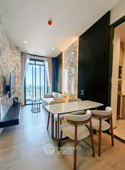 Modern living room with stylish decor and large windows offering city views