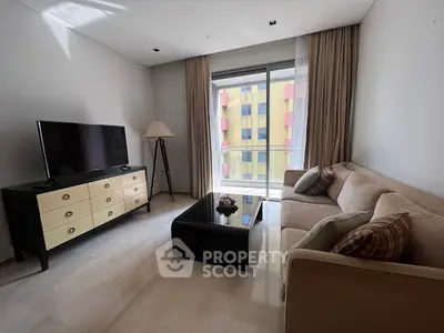 Spacious living room with modern furniture and large window view