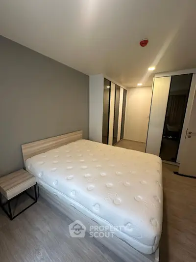 Modern bedroom with minimalist design and ample storage space