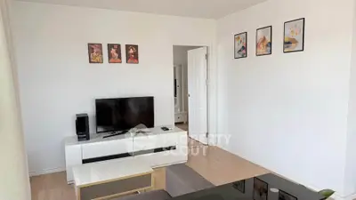 Modern living room with sleek furniture and stylish decor, perfect for comfortable living.