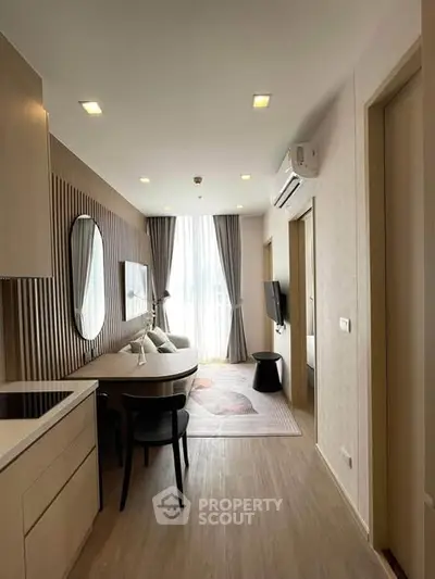 Modern living room with stylish decor and natural light in a contemporary apartment.