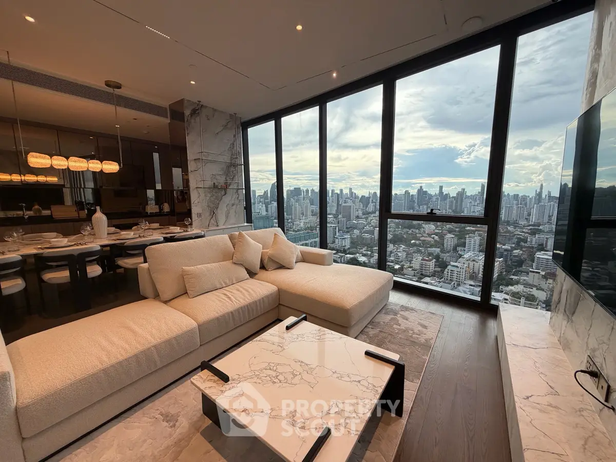 Luxurious living room with panoramic city view and elegant marble decor