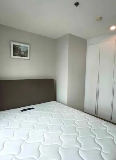 Modern bedroom with minimalist design and built-in wardrobe