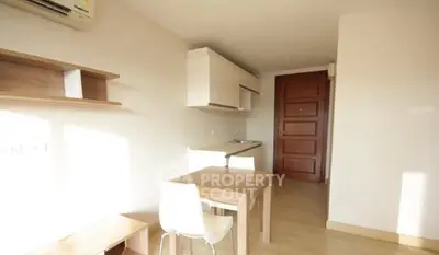 Modern minimalist kitchen with wooden accents and natural light