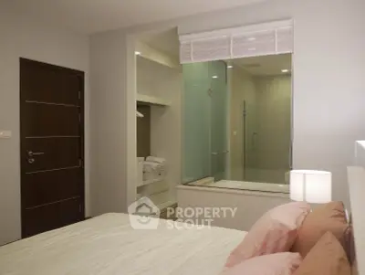 Modern bedroom with ensuite bathroom and cozy decor