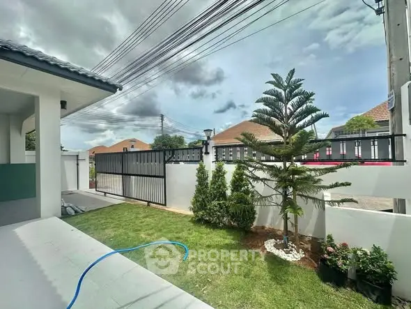 Charming suburban home with lush garden and modern fence