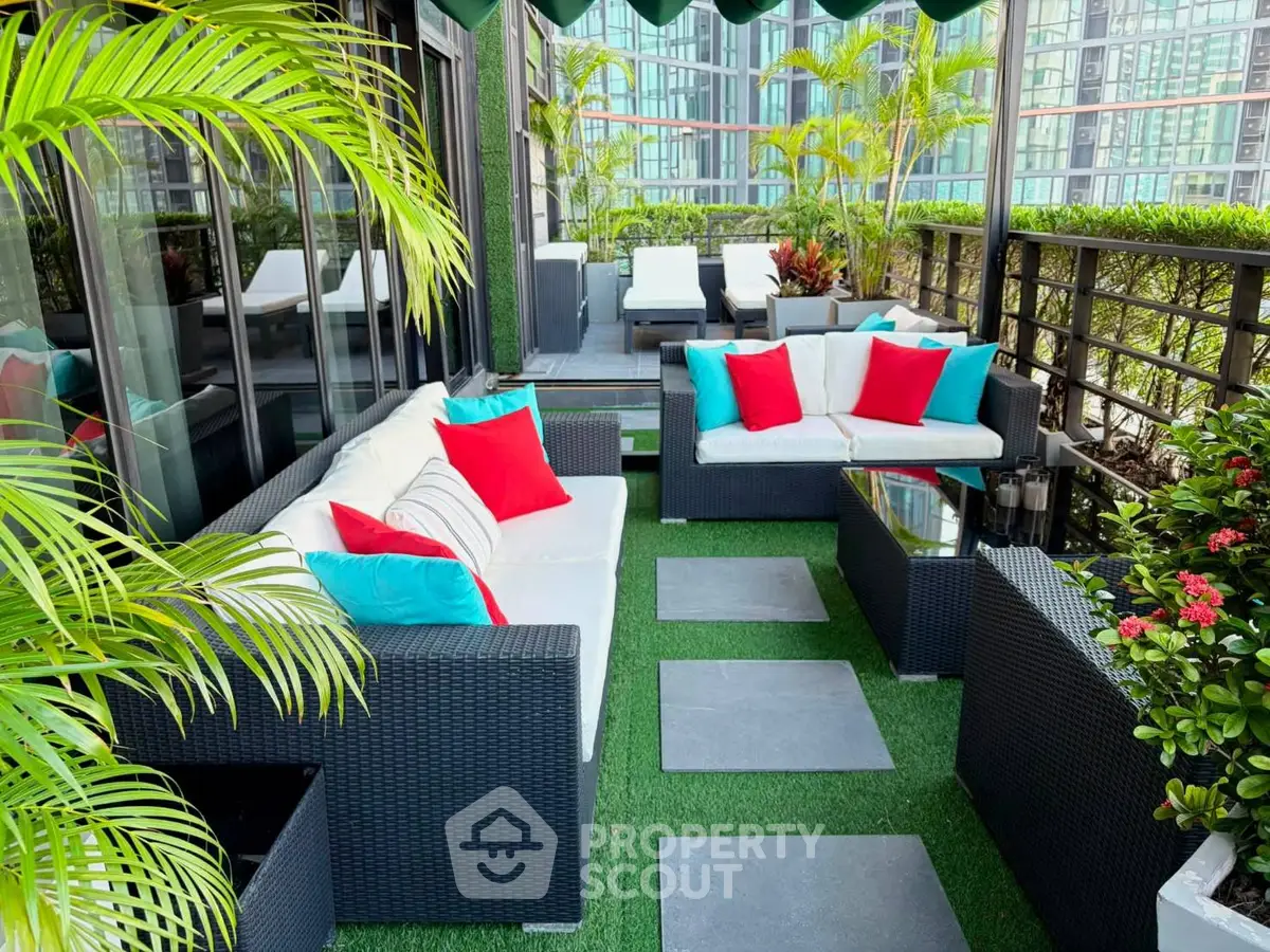 Luxurious rooftop terrace with stylish outdoor seating and lush greenery, perfect for relaxation and entertaining.