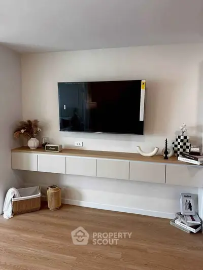 Modern living room with wall-mounted TV and stylish decor