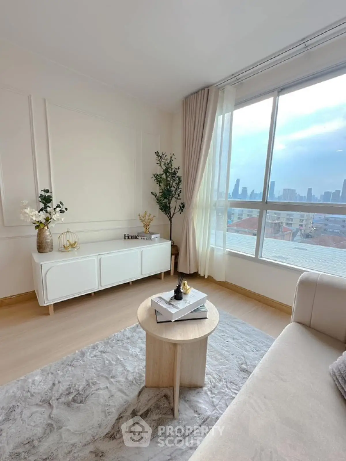 Bright modern living room with city view and elegant decor