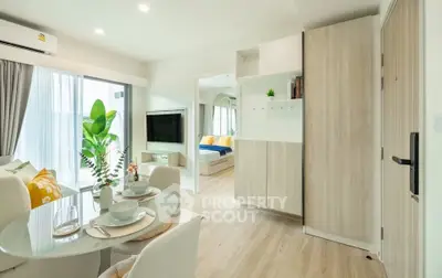 Modern open-plan living room with dining area and natural light