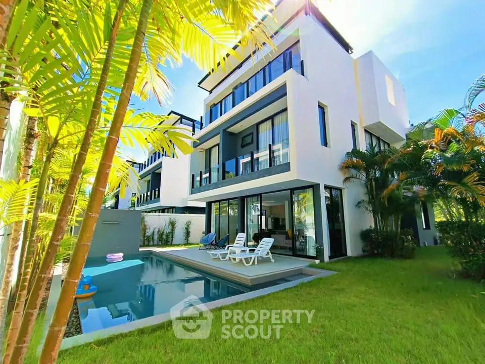 Luxurious modern villa with private pool and lush garden