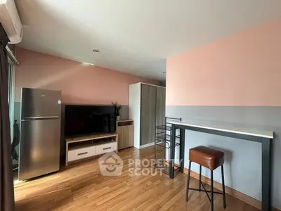 Modern living room with sleek furniture and wooden flooring