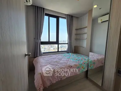 Cozy bedroom with city view and modern decor