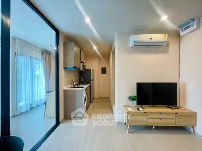 Modern living room with open kitchen and stylish decor in a bright apartment