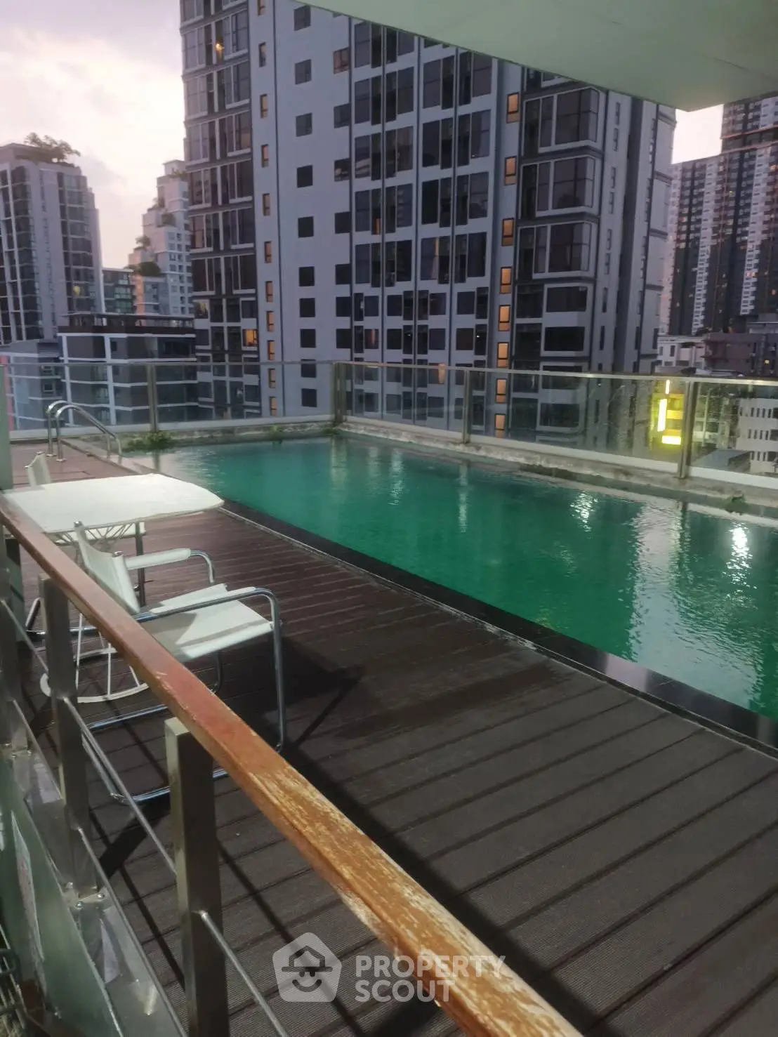 Luxurious rooftop pool with city skyline views, perfect for relaxation and entertainment.