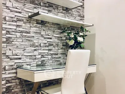 Modern study nook with stone accent wall and sleek white desk