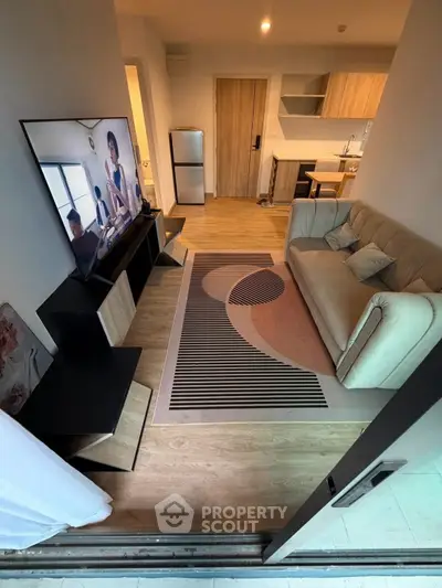 Modern living room with stylish decor and open kitchen layout