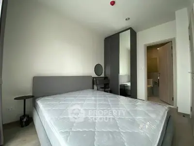 Modern bedroom with minimalist design and ensuite bathroom