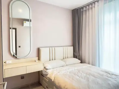 Modern bedroom with stylish decor and natural light