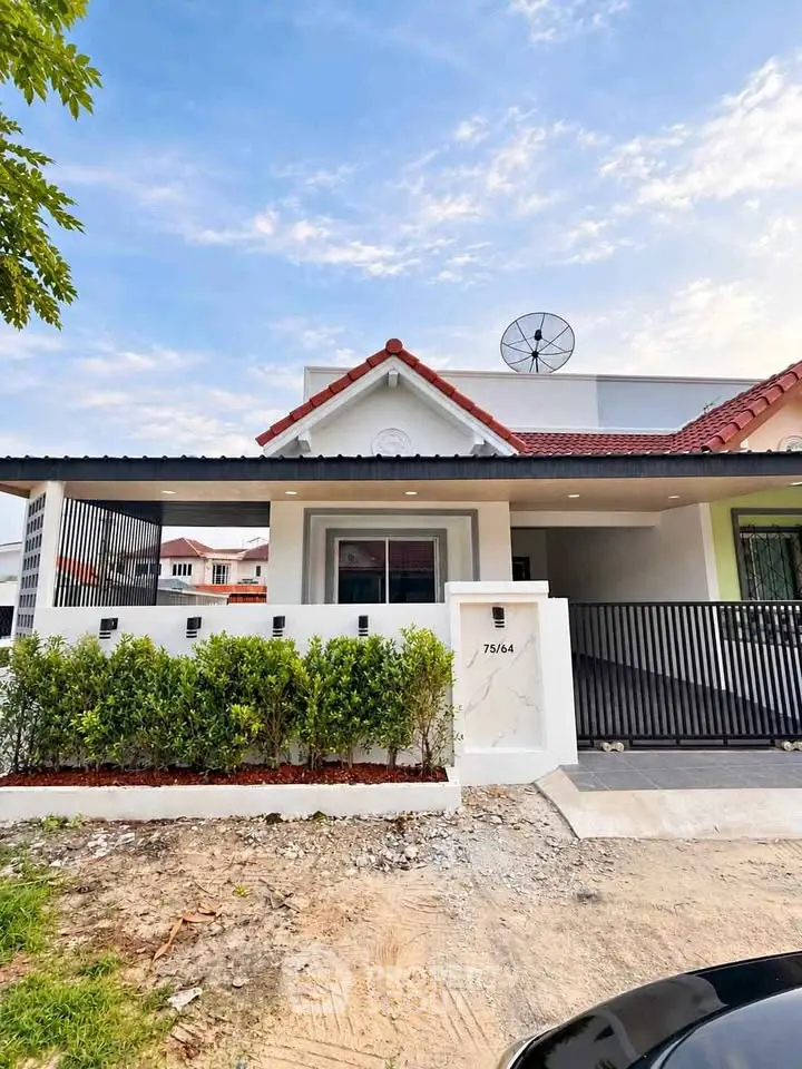 Charming single-story home with modern facade and gated driveway in a serene neighborhood.
