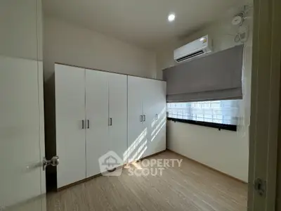Spacious bedroom with built-in wardrobe and air conditioning