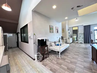 Spacious open-plan living area with modern decor and natural light