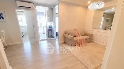 Spacious living room with elegant decor and cozy seating area