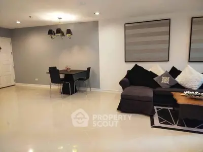 Spacious modern living room with elegant decor and cozy seating area.
