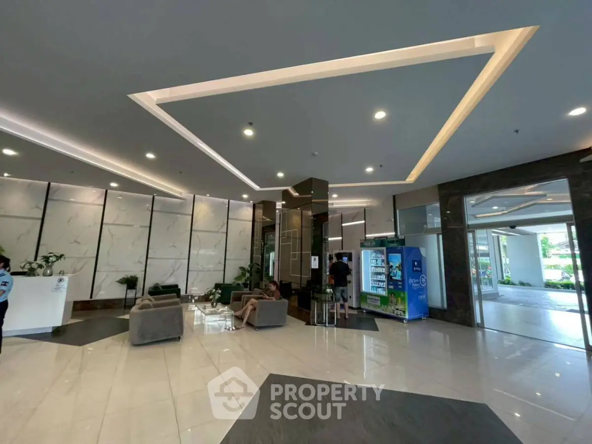 Luxurious modern building entrance with elegant seating and sleek design