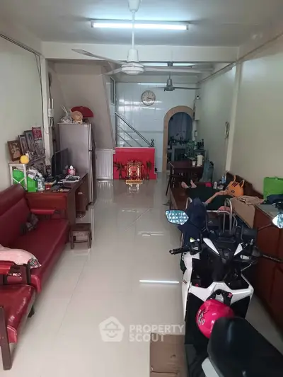 Spacious living room with modern decor and ample natural light