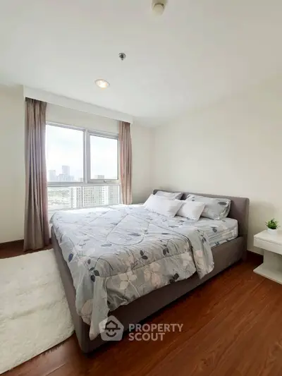 Bright and cozy bedroom with city view and modern decor