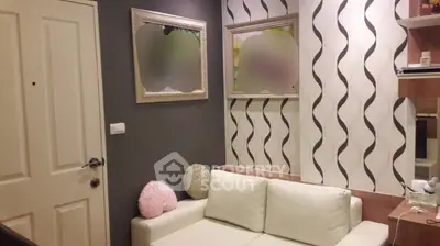 Chic modern living room with stylish wallpaper and cozy white sofa, perfect for urban living.