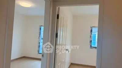 Bright interior view of a modern apartment with two rooms and natural light.