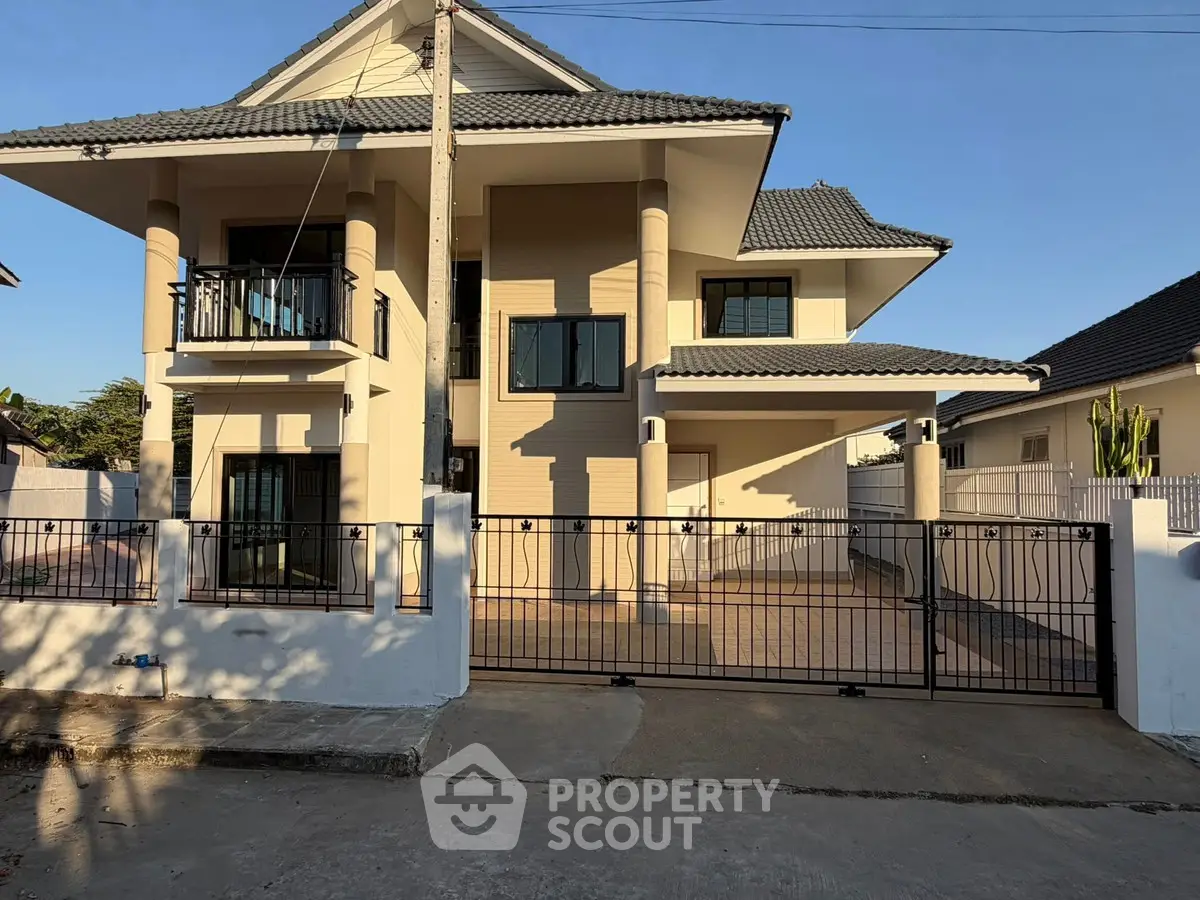 Stunning modern two-story house with spacious driveway and elegant balcony.