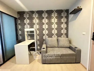 Modern living room with stylish wallpaper and compact furniture design