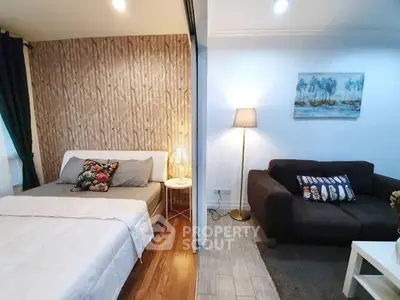 Modern studio apartment with cozy bedroom and stylish living area