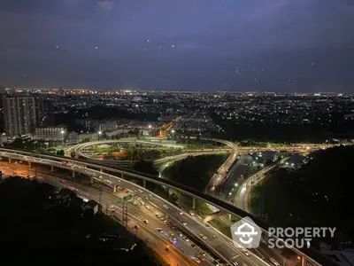 Stunning cityscape view with illuminated highways and urban skyline at night