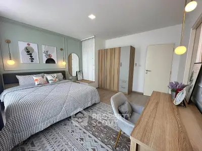 Spacious modern bedroom with stylish decor and natural light