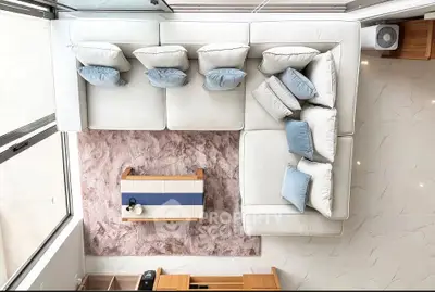 Modern living room with stylish white sectional sofa and elegant decor
