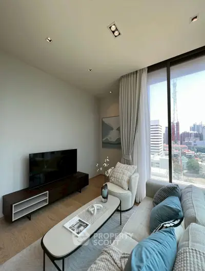 Modern living room with city view, stylish decor, and large windows.