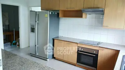 Modern kitchen with sleek appliances and ample storage space