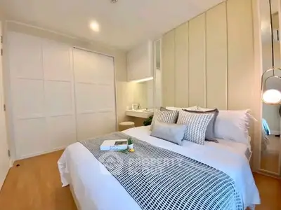 Elegant bedroom with modern decor and cozy ambiance, featuring a stylish bed and ample closet space.