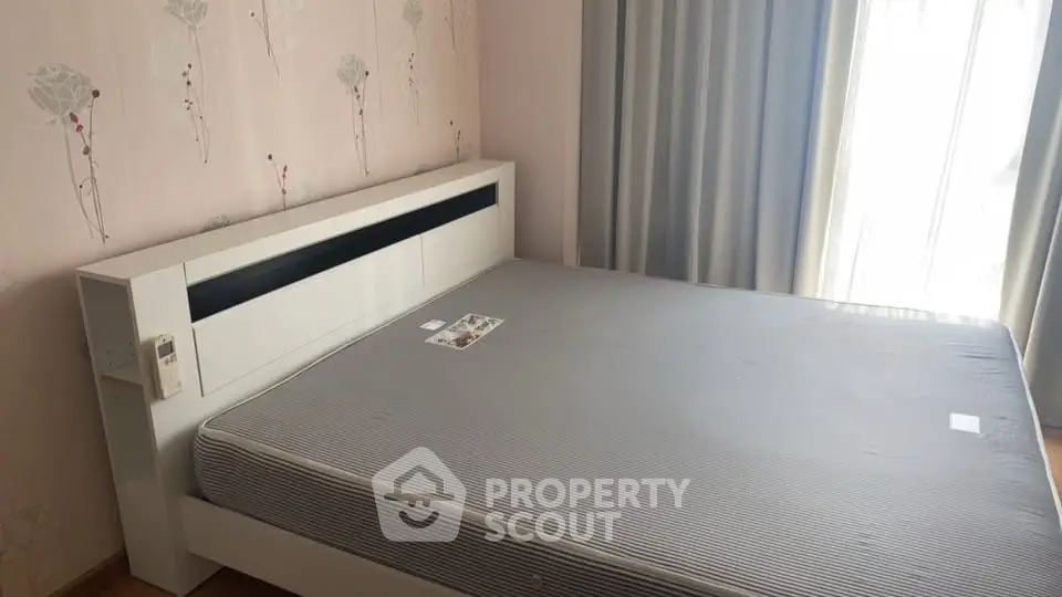 Spacious bedroom with modern bed and natural light